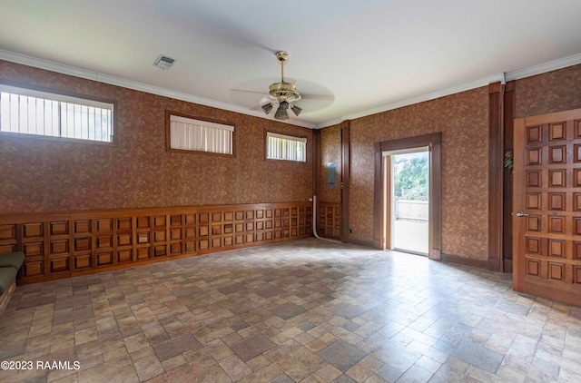 unfurnished room featuring ornamental molding, tile floors, and ceiling fan