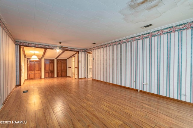 unfurnished room with ceiling fan and light wood-type flooring