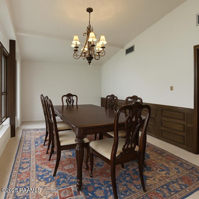 dining space with a chandelier