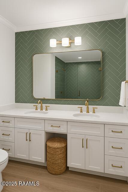 1721 Jane St, New Iberia, LA 70560 - bathroom with ornamental molding, wood finished floors, toilet, double vanity, and a tile shower