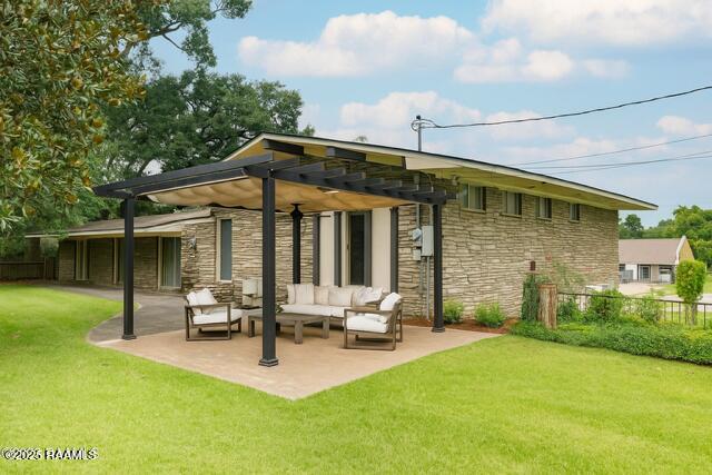1721 Jane St, New Iberia, LA 70560 - rear view of house featuring stone siding, an outdoor hangout area, a patio, and a pergola