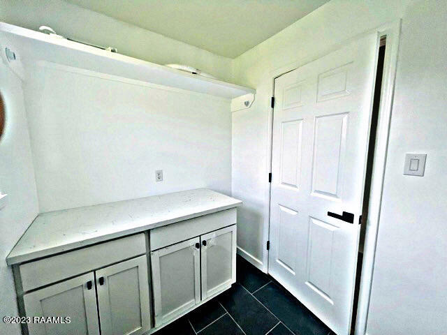 bathroom with tile patterned floors