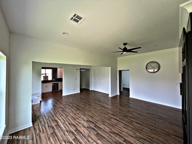 unfurnished living room featuring dark hardwood / wood-style floors and ceiling fan