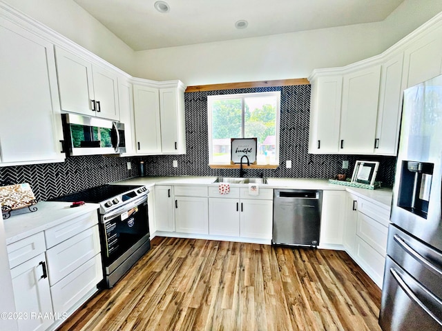 kitchen featuring white cabinetry, sink, and stainless steel appliances