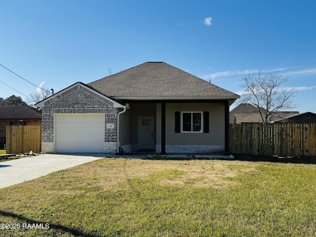 view of front of house featuring a front yard and a garage