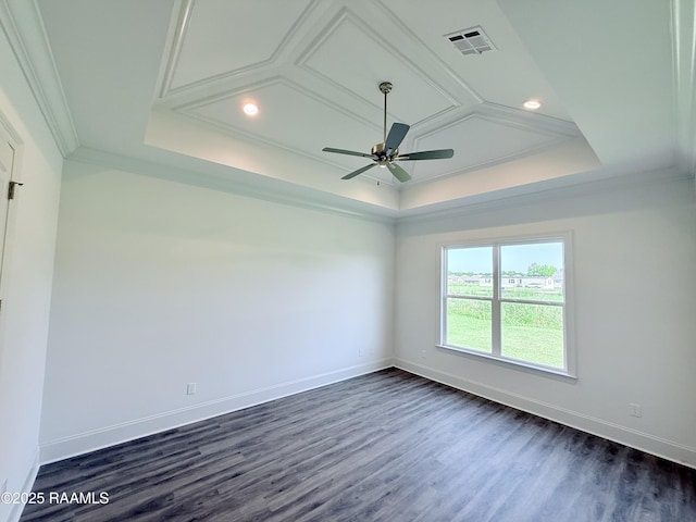 empty room with visible vents, baseboards, ceiling fan, crown molding, and a tray ceiling