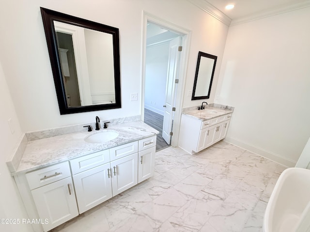full bath featuring two vanities, marble finish floor, a sink, and crown molding