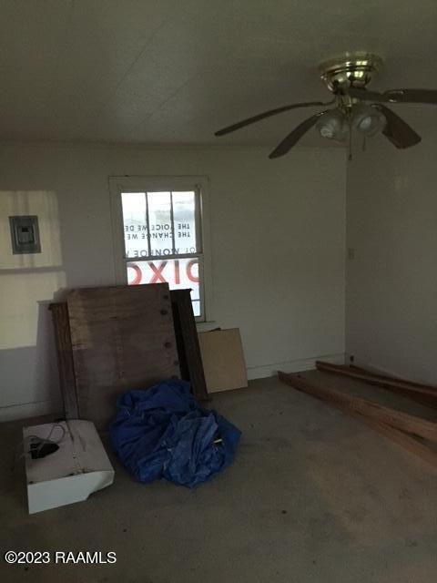 interior space featuring carpet flooring and ceiling fan