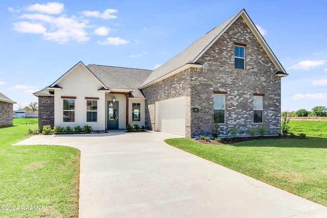 view of front facade featuring driveway, a front lawn, an attached garage, a shingled roof, and brick siding