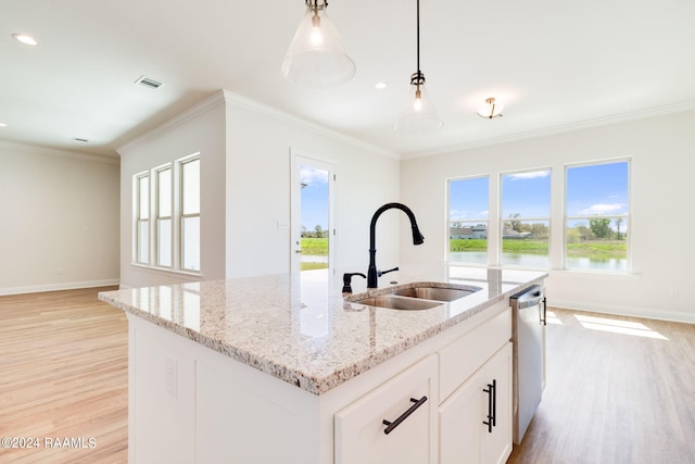 kitchen with visible vents, dishwasher, crown molding, and a sink