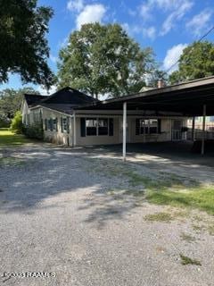 exterior space with a carport