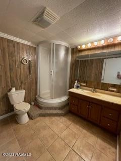 bathroom featuring ornamental molding, tile flooring, toilet, and vanity