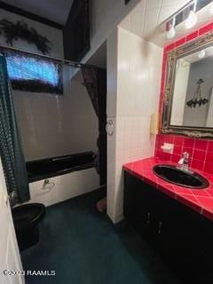 bathroom with oversized vanity, tasteful backsplash, and toilet