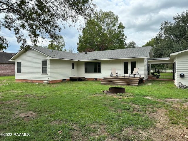 rear view of property with a lawn