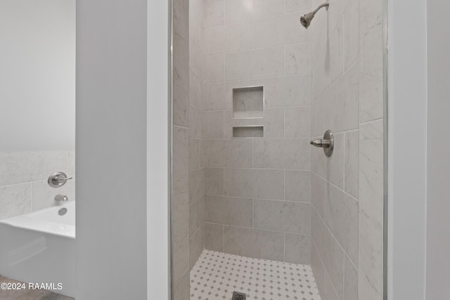 bathroom featuring plus walk in shower