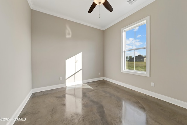 spare room featuring crown molding, ceiling fan, and concrete floors