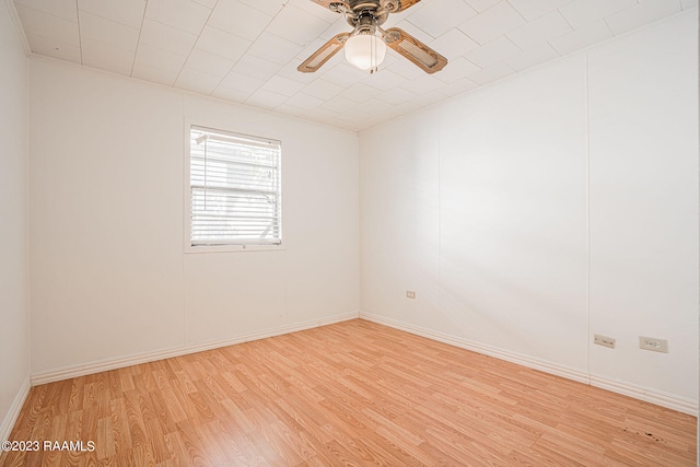 unfurnished room with ceiling fan and light hardwood / wood-style flooring