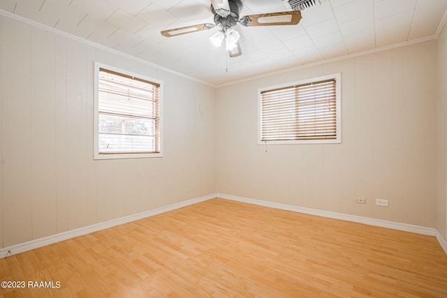 unfurnished room with crown molding, ceiling fan, and light hardwood / wood-style flooring