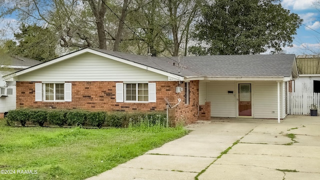 ranch-style house with a front lawn