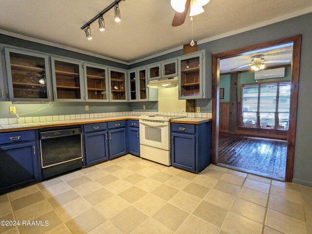 kitchen featuring ceiling fan, electric range, blue cabinetry, and black dishwasher