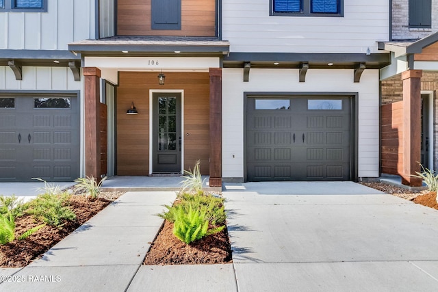 view of exterior entry with a garage