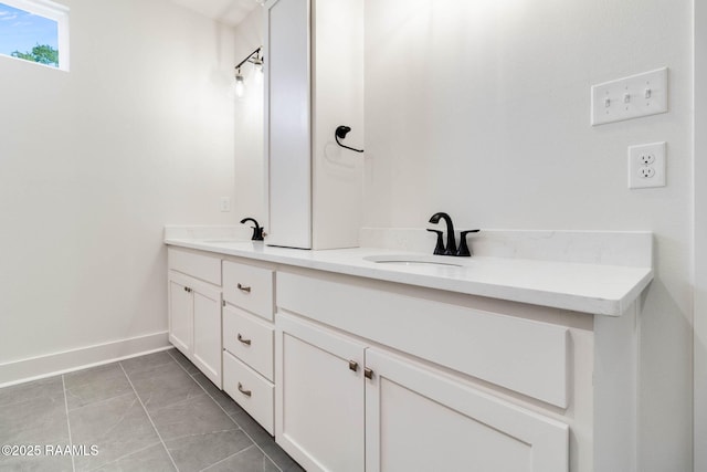 bathroom with tile patterned flooring and vanity