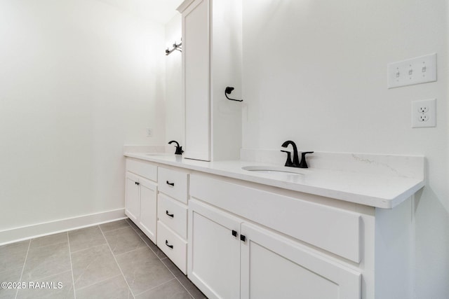 bathroom with vanity and tile patterned floors