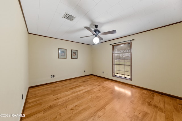 unfurnished room with ornamental molding, light hardwood / wood-style floors, and ceiling fan