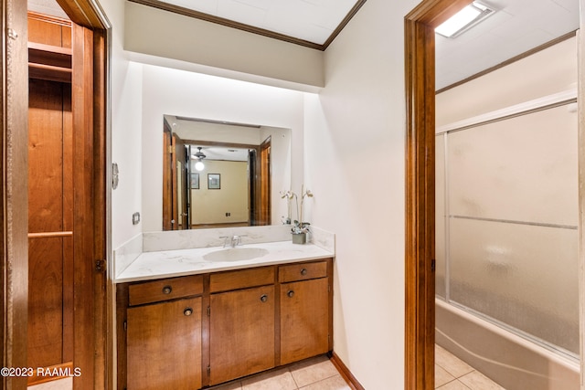 bathroom with tile patterned flooring, vanity, crown molding, and shower / bathing tub combination