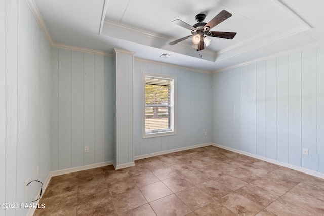 unfurnished room with ceiling fan, ornamental molding, and a tray ceiling