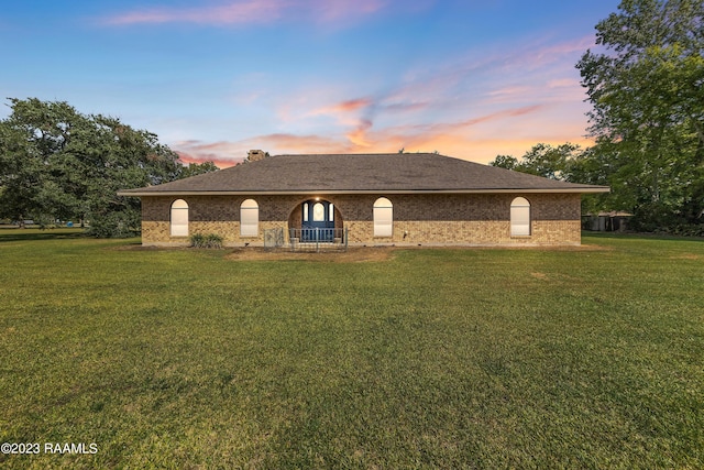 view of front of home with a yard