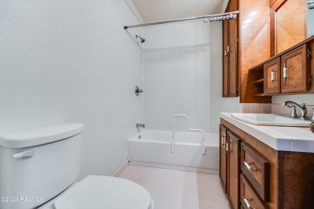 full bathroom featuring toilet, vanity, washtub / shower combination, ornamental molding, and tile flooring