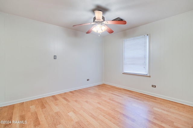 empty room featuring ceiling fan and light hardwood / wood-style floors