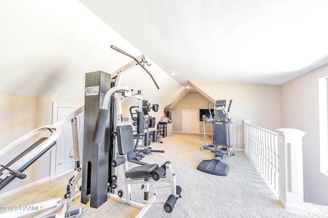 workout area with light colored carpet and lofted ceiling