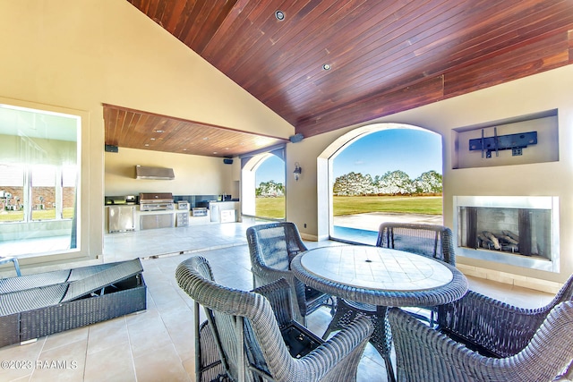 view of patio featuring a grill, area for grilling, and a fireplace