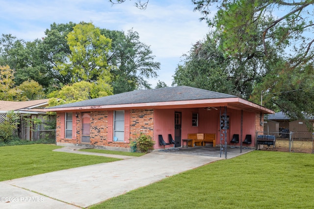 view of front facade with a patio and a front lawn