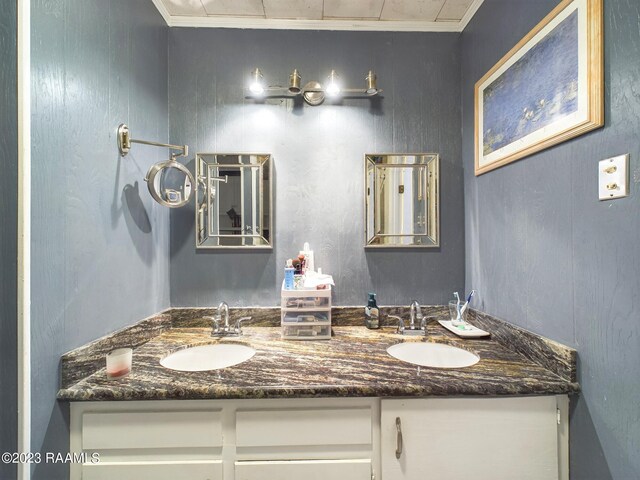 bathroom featuring vanity and ornamental molding