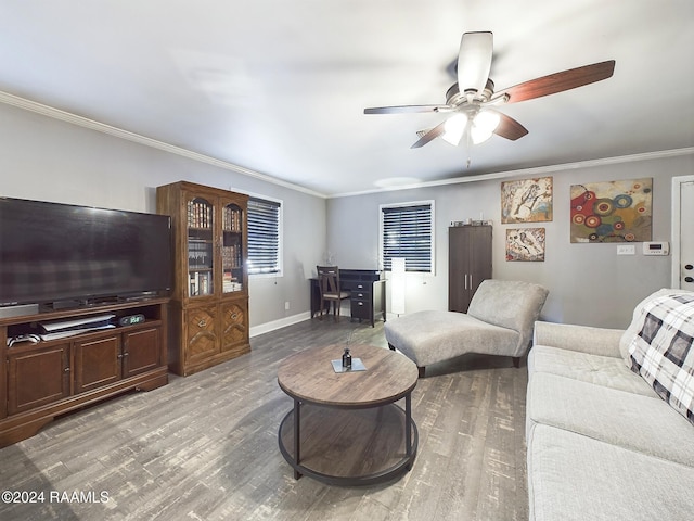 living room featuring hardwood / wood-style floors, ceiling fan, and crown molding