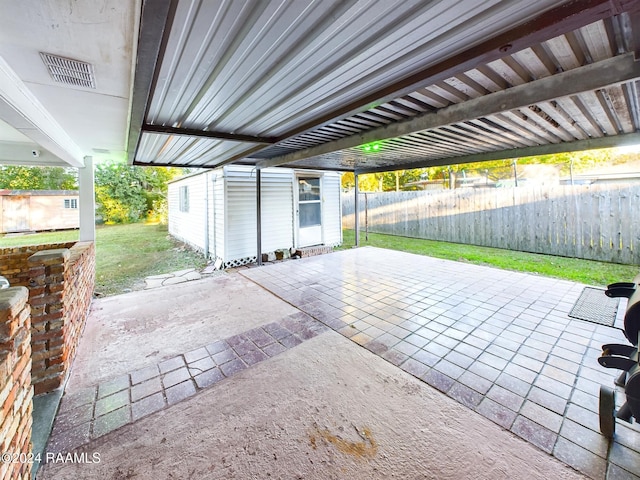 view of patio / terrace with an outbuilding