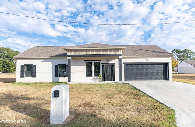 view of front of house with a front lawn and a garage