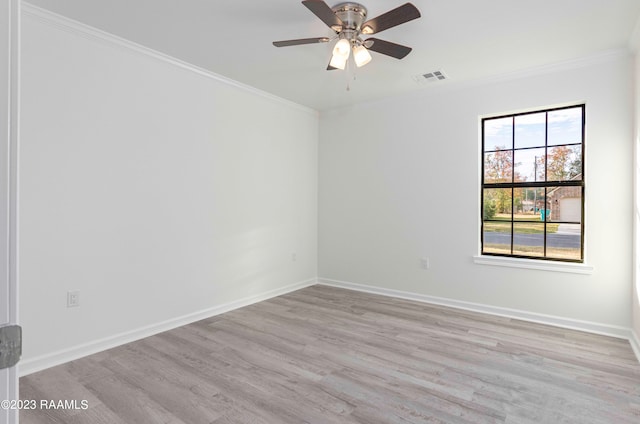 empty room with crown molding, ceiling fan, and light hardwood / wood-style flooring