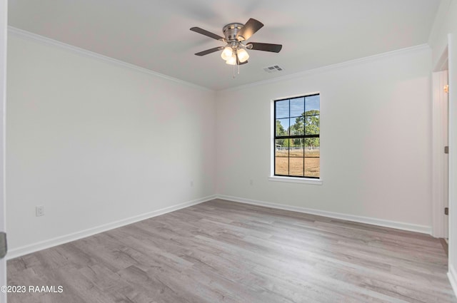 spare room with ceiling fan, crown molding, and light hardwood / wood-style floors