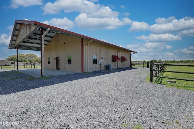 exterior space with a patio area and central air condition unit