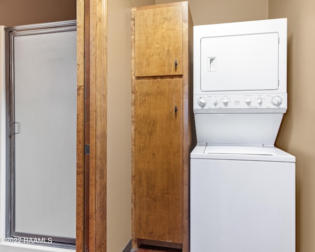 washroom with stacked washer and clothes dryer