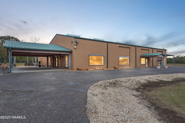 view of outdoor building at dusk