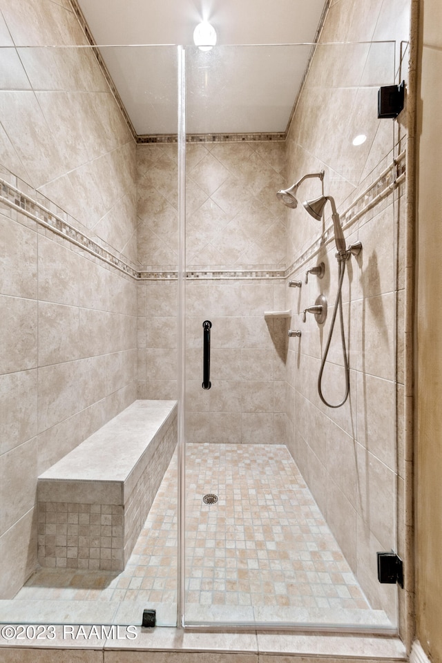 bathroom with a shower with shower door