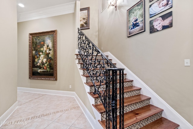 stairway featuring tile patterned floors and ornamental molding