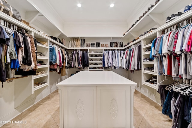 spacious closet with light tile patterned floors