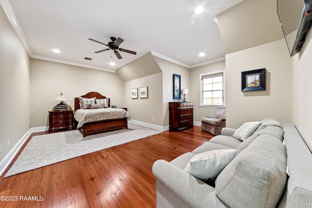 bedroom with hardwood / wood-style flooring, ceiling fan, and crown molding