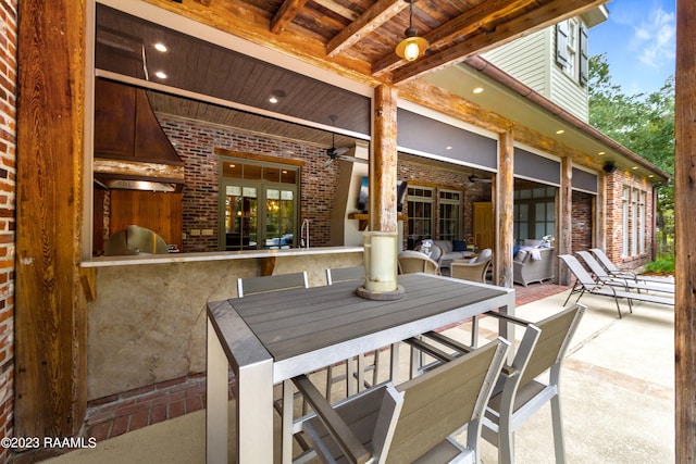 view of patio with ceiling fan and a grill